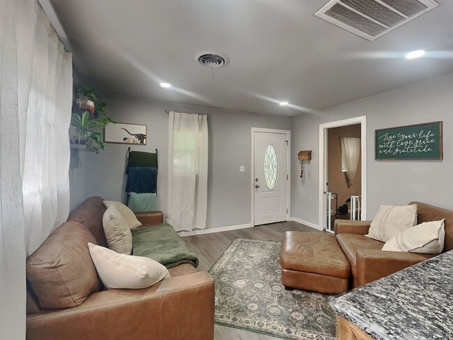 Building Photo - Front Porch Charm & Backyard Dreams!