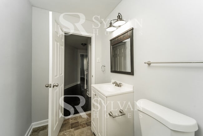 Building Photo - The living is easy in this 4 bedroom, 2 bathroom townhome