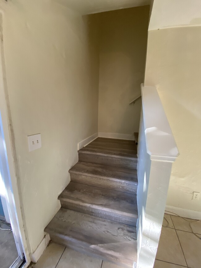 LVP plank custom stairs - 2858 Wonderwood Ln