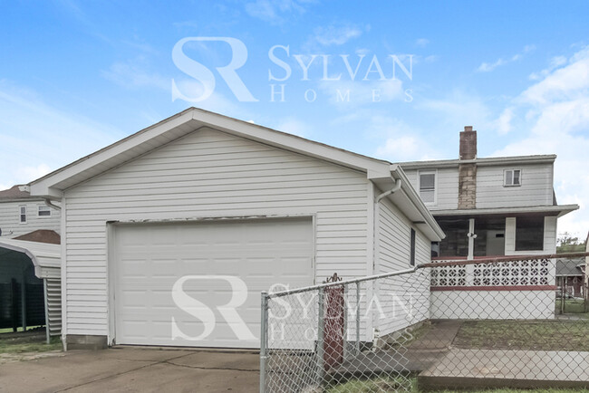 Building Photo - You will love this adorable brick home