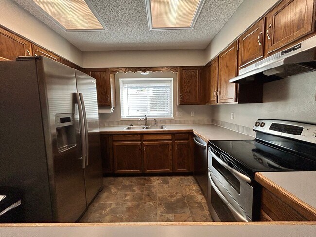 Building Photo - Spacious 3BR Duplex w/ Garage, Workshop, Large Backyard & Patio