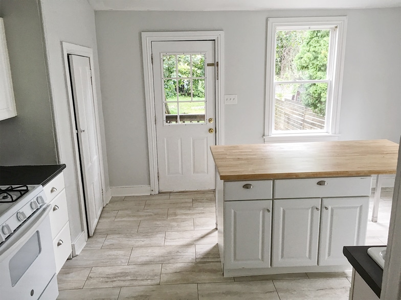 Brand new kitchen floor and new gas range. - 817 W Bridge St