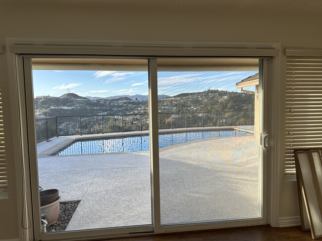 Double glass doors leading from the family room to the backyard and pool. - 3816 San Augustine Dr