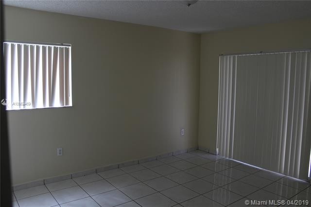 Building Photo - 4680 NW 102nd Ave  104-20