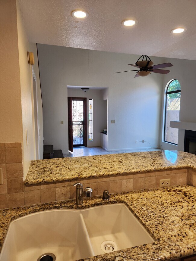 Looking from kitchen towards front door. - 5640 E Bell Rd
