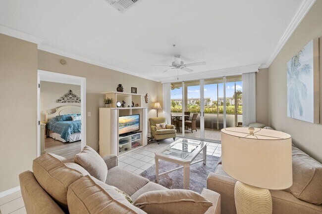 Building Photo - first-floor unit featuring a 2 bedroom, 2 bath fully furnished