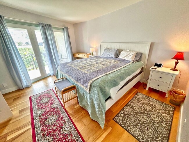 Building Photo - Steps to the beach from this Ocean View Condo with 2 car garage