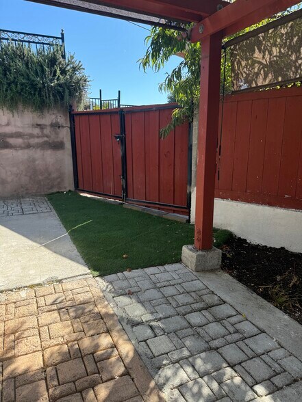 Part of the front yard with synthetic grass - 1178 Tiegen Dr