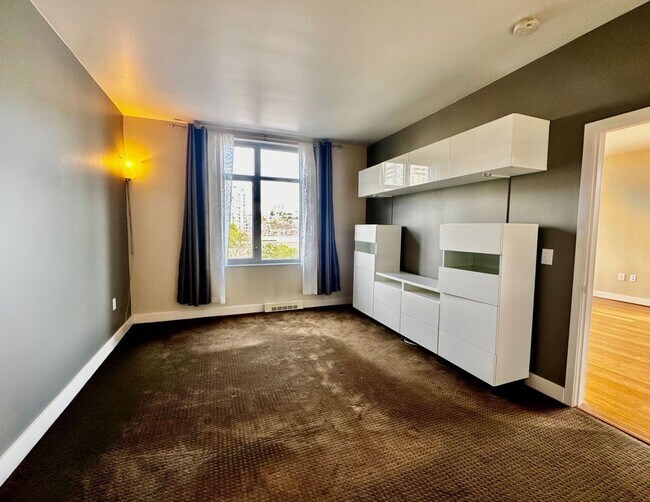 Building Photo - Corner Light. City Energy. Zero Compromise.