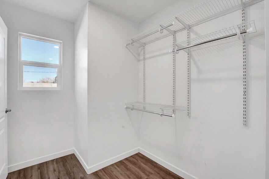 walk-in closet with window onto private backyard - 1774 Willow Trl