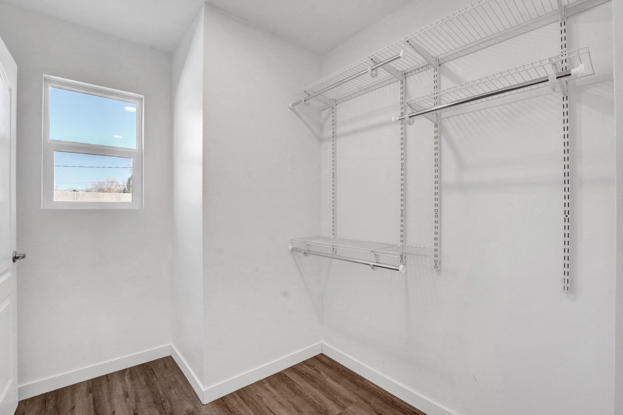 walk-in closet with window onto private backyard - 1774 Willow Trl