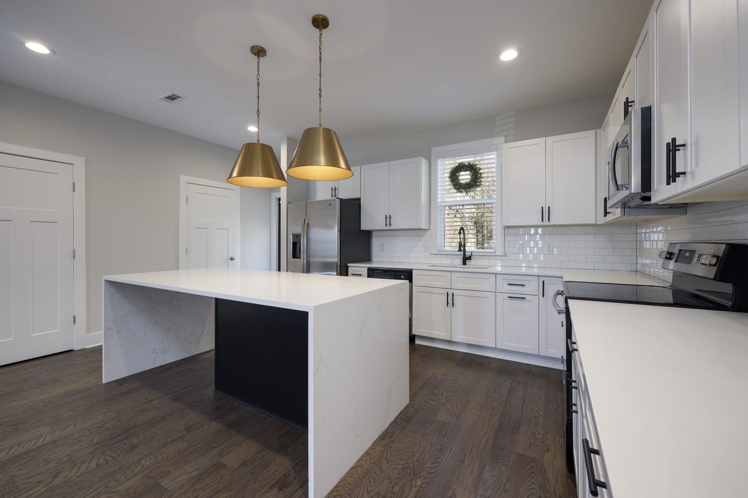 Waterfall island with white cabinetry - 726 Mill Creek Meadow Dr