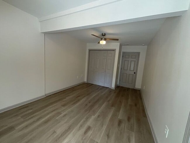 Building Photo - **Spacious 4BR with Modern Upgrades & Cove...