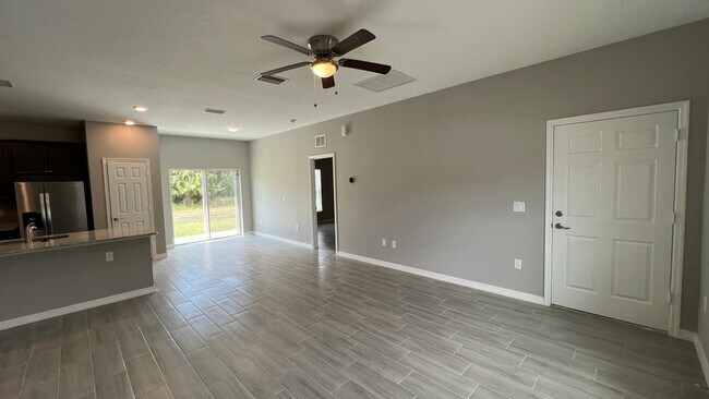 Building Photo - Smart & Stylish 3BD/2BA Palm Bay Home – Modern Upgrades, No Water Bills!