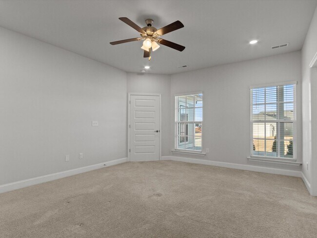Building Photo - 3 Car Garage! Modern end-unit townhome located in the desirable Clift Farm!
