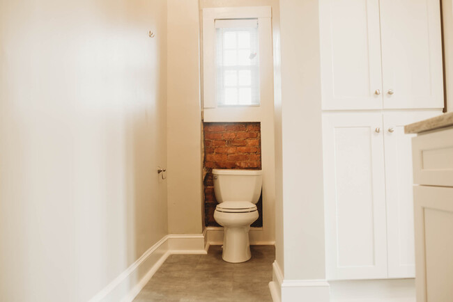 Exposed brick in Bathroom - 529 E Washington St