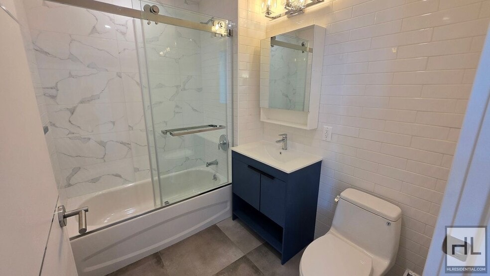Building Photo - Top-Floor 1-Bedroom with Private Balcony & Manhattan Skyline Views!
