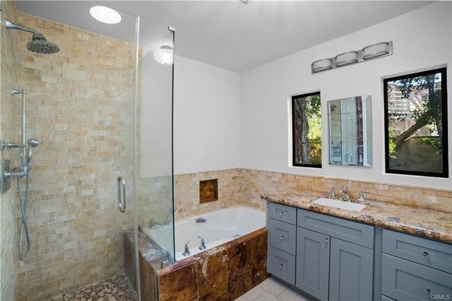 Building Photo - Tucked away behind gorgeous grand gates is this beautifully updated 3 bedroom 2 bath home