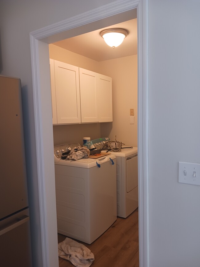 laundry room with new washer and dryer (trash to be removed) - 873 Sedge Ct