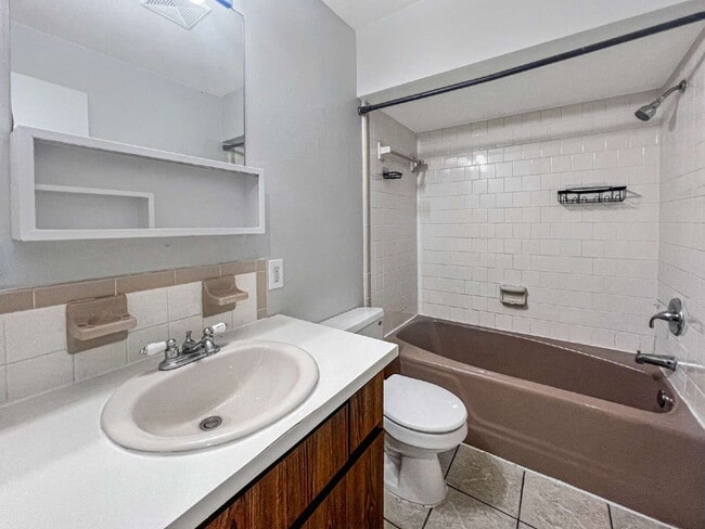 Building Photo - Budget-Friendly. Bold Personality. Big Aut...