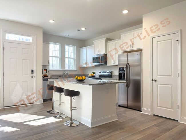 Building Photo - Modern Comfort Meets Peaceful Living—Stunning 3 Bedroom Townhome Near Downtown Raleigh Available ...