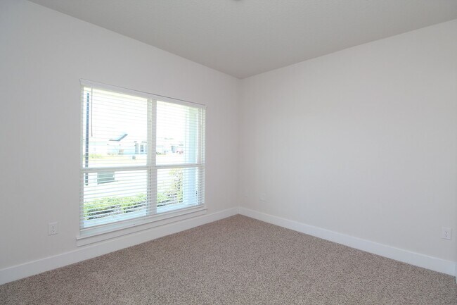 Building Photo - Don’t Miss This 4BR Home — 3-Car Garage, Modern Interior, Open Layout & Community Pool in Prime 9...