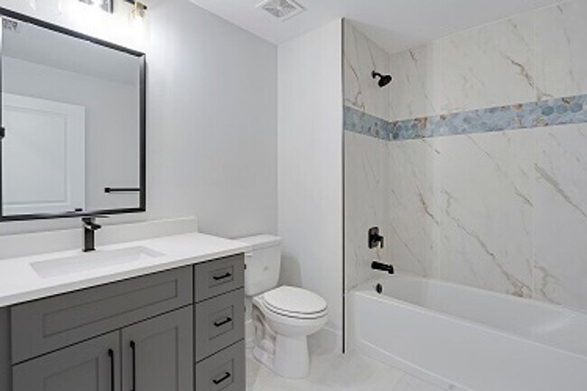 Building Photo - 2023 Duplex All tiled - 3 Bedroom Plus Den/2 Bath & 2 car Garage