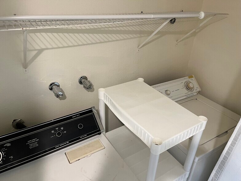 Laundry closet with shelves - 65 NE 19th St