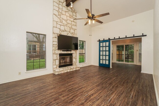Building Photo - Charming 2-Bedroom Condo in Gated Community Surrounded by Mature Trees