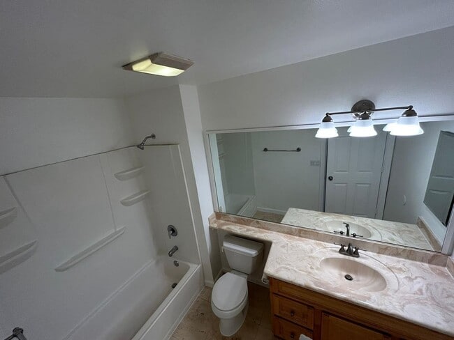 Building Photo - 2 Bedroom 1.5 Bath Townhome. Gated Community. Upgraded & 2 Parking Spaces