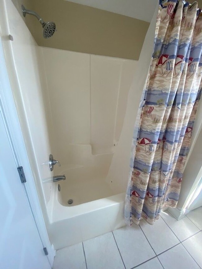 Building Photo - Nicely furnished garage apartment in gated...