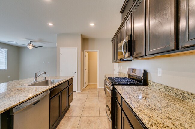 Building Photo - Spacious Townhouse with Loft & Rare 3-Car Garage!