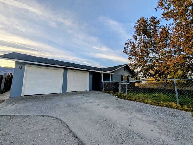 Building Photo - 4-bedroom house with a 2-car garage availa...