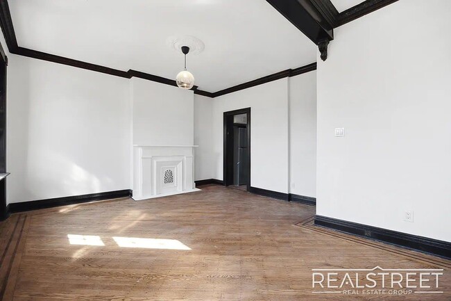 Building Photo - Timelessly Renovated Historic Triplex with...