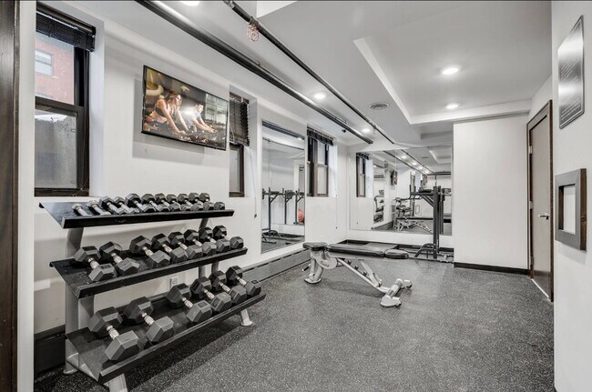 Building Photo - "Charming Studio Retreat with Hardwood Elegance in Downtown Minneapolis!"