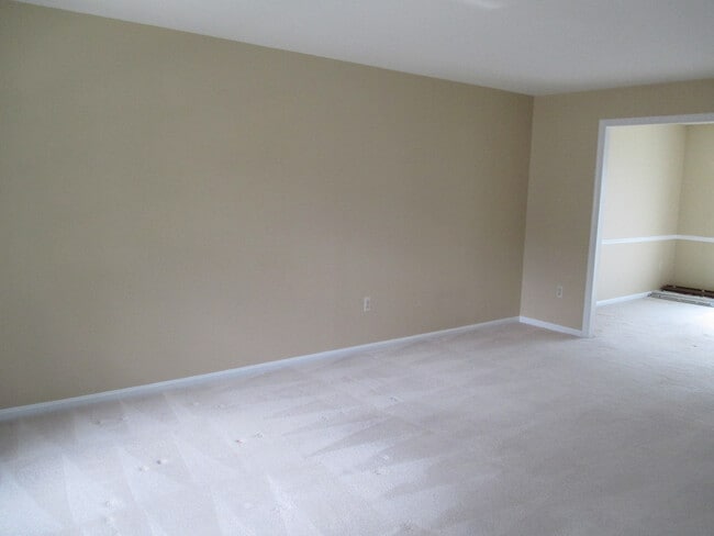 Building Photo - SPACIOUS BRICK TOWN-HOME