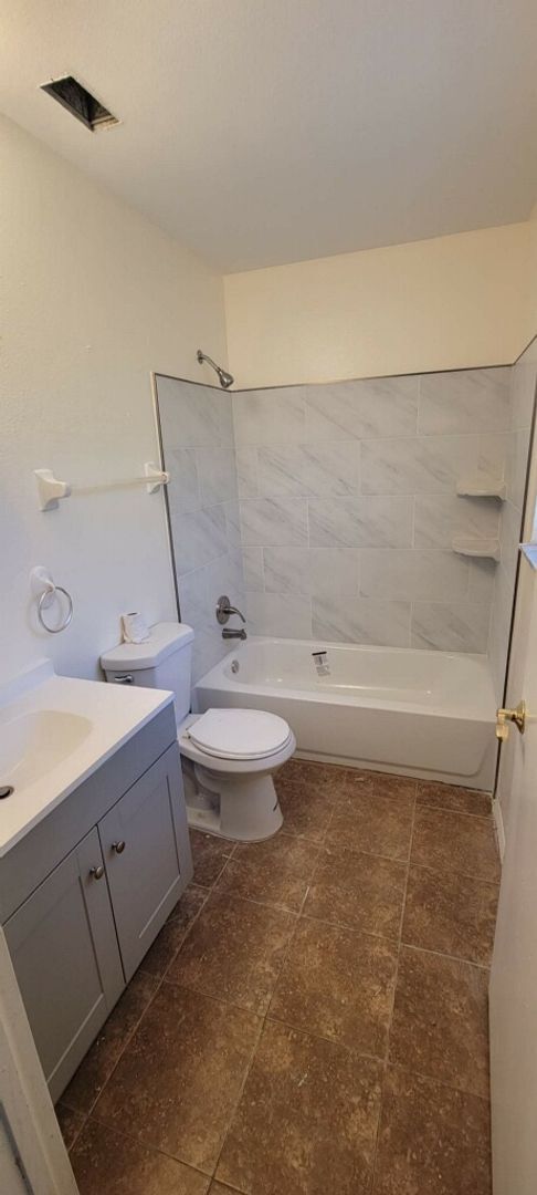 Building Photo - 2/2/1 home with a spacious fenced backyard...