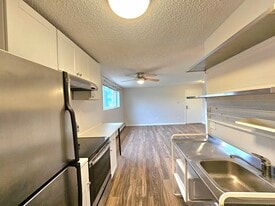 #102 Kitchen onlooking Nook and LR - 12th and Wads Residences