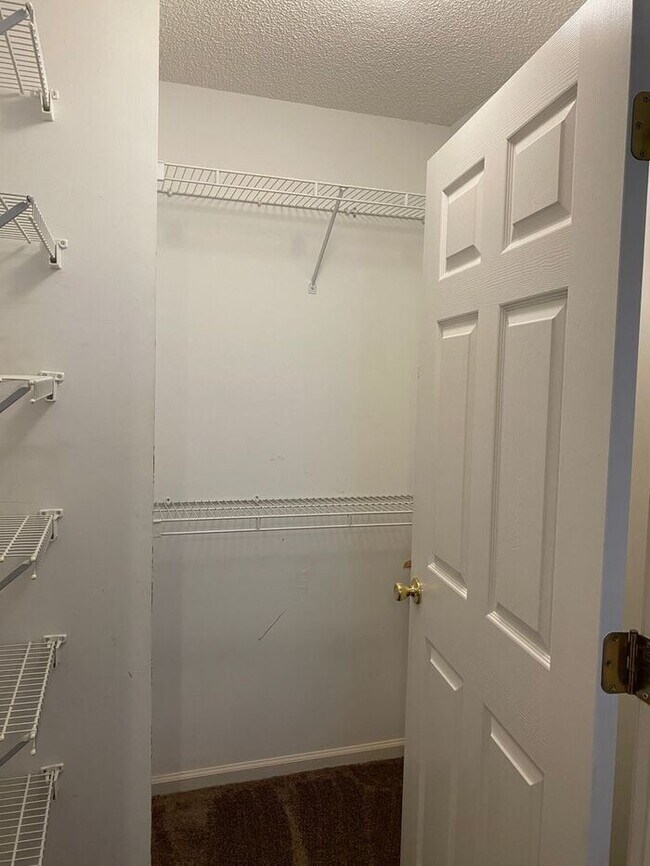 Building Photo - Furnished! Breezewood ground floor unit, Open floor plan, fire place, patio, large closets, wood ...