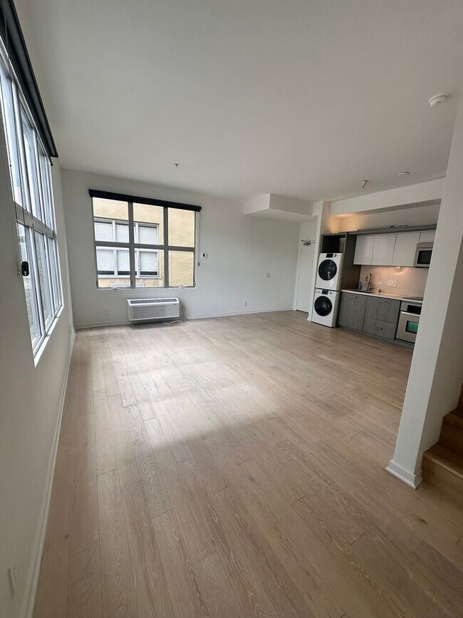 Building Photo - DOWNTOWN GEM | Modern Two-Level Loft with Private Patio & Rooftop Deck