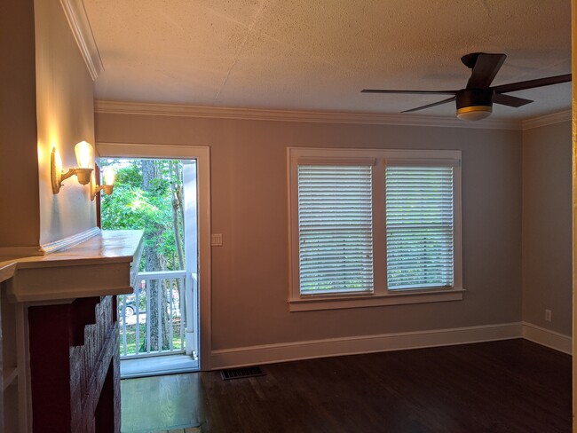 living room facing south, non operational fireplace - 720 Berne St SE Apt B