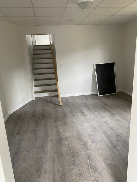 Living room. 2 bedrooms are up the short flight of stairs. - 357 Sherwood Rd