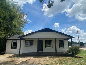 Building Photo - Completely Renovated 4 Bedrooms / Covered ...