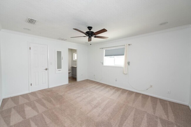 Building Photo - Live the ultimate Space Coast waterfront lifestyle at this stunning beachside canal home in Satel...