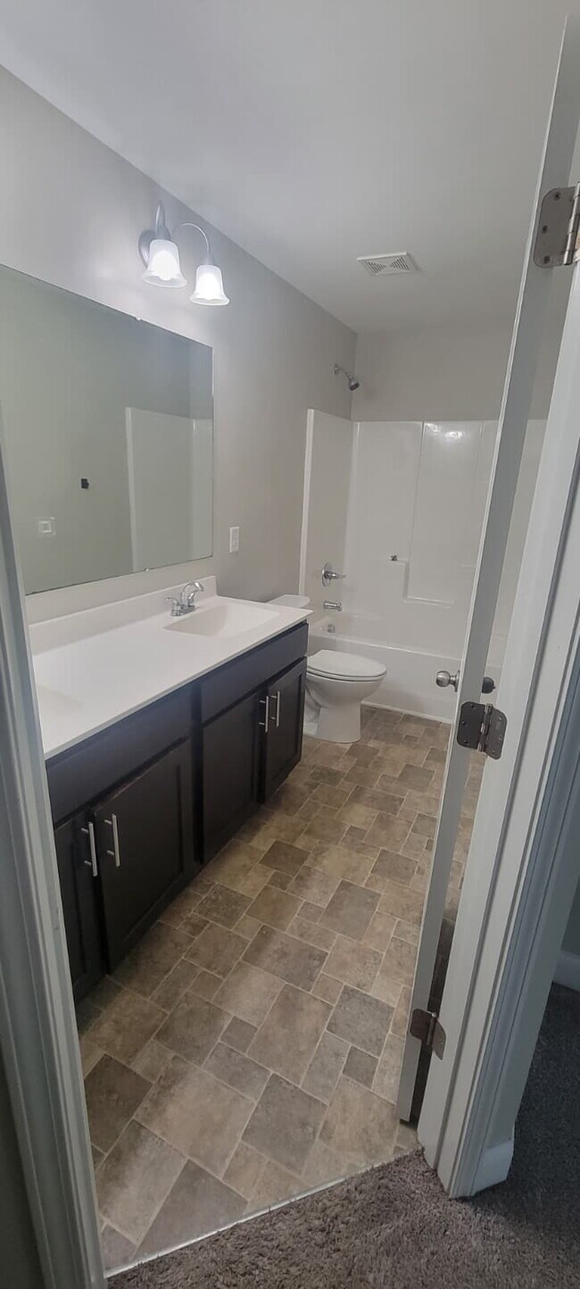Building Photo - Spacious Elegance Awaits: 4-Bedroom Gem with Granite Countertops on Harrington Road!