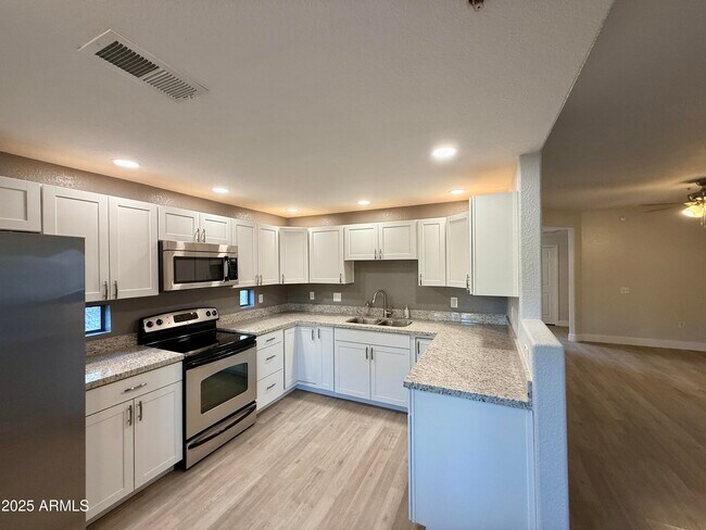 Building Photo - 9555 E Raintree Dr
