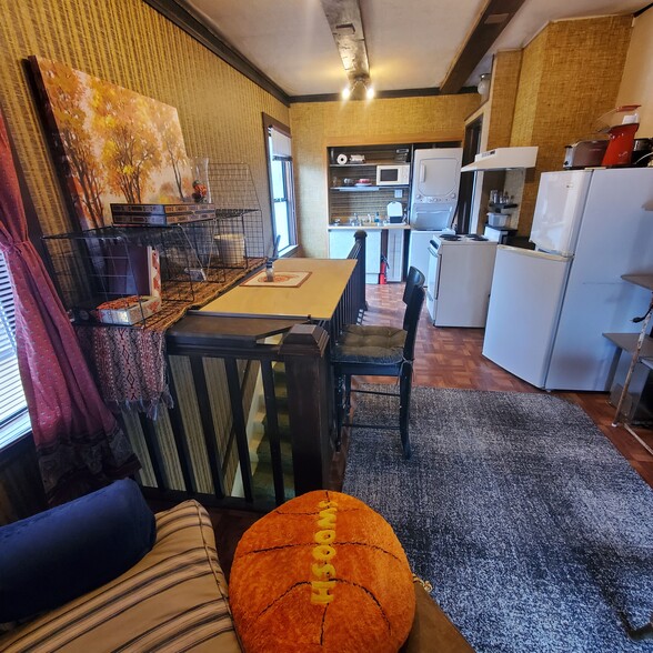 View of apartment dining kitchen w fridge sove sink waser/dryer - 3829 SE Washington St