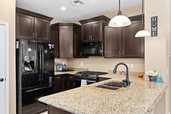 Building Photo - Welcome Home! This stunning 4 bedroom, 3 b...