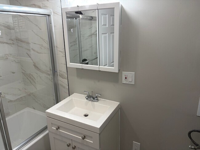 Building Photo - Newly Renovated 2- Story Townhome with Front Porch and Back Yard