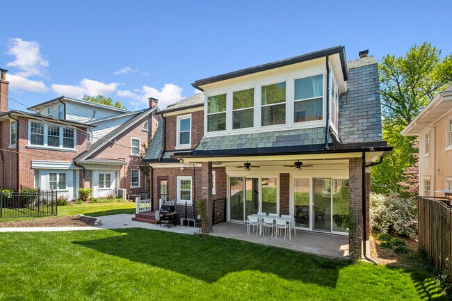 Backyard, patio with ceiling fans and lights. - 31 Dartford Ave